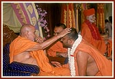 Swamishri blesses Pujya Bhadresh Swami for having attained a Ph. D. in Sanskrit