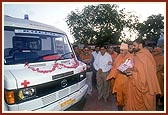 Swamishri performs pujan of a new ambulance in the services of 'Pramukh Swami hospital' at the BAPS Mandir in Atladra