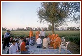 Swamishri observes the site plan on the land for the new BAPS Swaminarayan Mandir&nbsp;&nbsp;