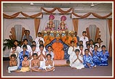 Swamishri with BAPS children after performing a dance on Children's Day program