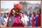 Tribal devotees donned in traditional garbs welcome Swamishri on his arrival to Poshina