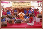 Swamishri blesses the tribal dance group of devotees