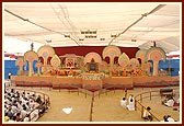 The colorful festival stage with senior sadhus 