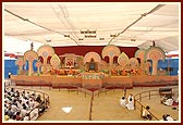 The colorful festival stage with senior sadhus 