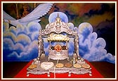 Shri Harikrishna Maharaj in an ornate cradle