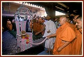 Swamishri rocks Shri Harikrishna Maharaj in a traditional decorative hindolo gifted by a devotee