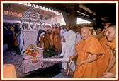 Swamishri rocks Shri Harikrishna Maharaj in a traditional decorative hindolo gifted by a devotee