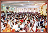 Devotees seated in the mandir assembly hall