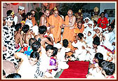Swamishri blesses the children who participated in the program