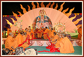 Sadhus offer an 84ft long garland to Swamishri