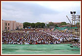 Thousands of devotees attend the evening satsang assembly