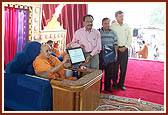 Swamishri is presented with a citation of Chicago Building Congress Merit Award presented to BAPS Swaminarayan Mandir in Chicago