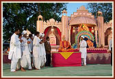 Youths perform a drama in the Yogi Jayanti celebration assembly