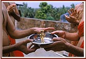 Shri Harikrishna Maharaj is bathed in the first monsoon rain