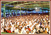 Devotees keenly listen to the discourse