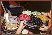 Shri Harikrishna Maharaj is offered cucumber, grams, mung, jambu and pomegranates on the occasion of Rath Yatra festival