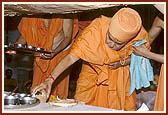 Placing the auspicious articles (that were worshipped) in the pit on which the murti is to be established