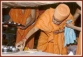 Placing the auspicious articles (that were worshipped) in the pit on which the murti is to be established
