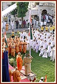 After the flag-hoisting ceremony devotees salute while singing the national anthem