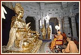 Swamishri before the murtis of Bhagwan Swaminarayan and Guru Parampara during the rituals of Pindika pujan