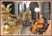 Swamishri before the murtis of Bhagwan Swaminarayan and Guru Parampara during the rituals of Pindika pujan