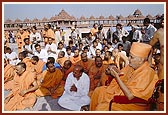 After the earthquake Swamishri, sadhus and devotees engage in chanting dhun outside the Swaminarayan Akshardham monument