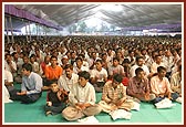 Devotees attentively listen to the discourses