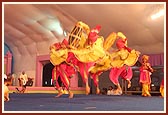 BAPS children and teenagers enthusiastically perform a traditional dance