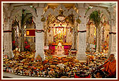 A grand annakut arranged in front of Thakorji in the mandir