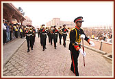 BAPS band from Nairobi honor and lead in front of Swamishri's car for the morning puja