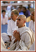 A parshad engaged in prayer during his diksha ceremony