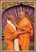 Swamishri lovingly blesses Ishwarcharan Swami for his services