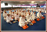 Parshad and sadhaks on stage during the diksha rituals