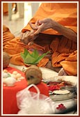 Pujya Mahant Swami and Pujya Kothari Swami perform the initial rituals of murti-pratishtha 