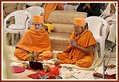 Pujya Mahant Swami and Pujya Kothari Swami perform the initial rituals of murti-pratishtha 