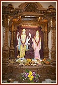 Murtis of Shri Laxmi-Narayan inside the monument with offerings of annakut
