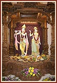Murtis of Shri Radha-Krishna inside the monument with offerings of annakut