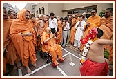 A satsangi boy, dressed as Shri Ganesh, dances before Swamishri