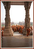 All the sadhus lend a hand in carrying the chal murti of Bhagwan Swaminarayan inside the monument for the murti-pratishtha rituals