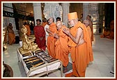 Senior sadhus praying in front of the chal murtis