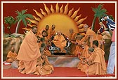 Sadhus of BAPS Swaminarayan Mandir, Atladra, present a garland to Swamishri
