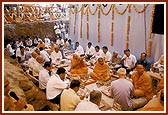Performs arti during the foundation-stone laying ceremony of the guru shikhars