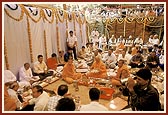 Performs arti during the foundation-stone laying ceremony of the guru shikhars
