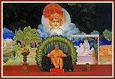 Swamishri on stage with the backdrop depicting different incidents from the life of Bhagwan Swaminarayan 