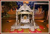 Shri Harikrishna Maharaj in a decorated cradle