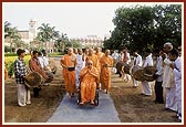 Tribal devotees from Poshina traditionally welcome Swamishri by playing drums 