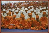 Newly initiated sadhus and parshads listen to Swamishri's blessings