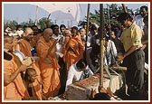 Swamishri performs the first stone-laying ceremony for the new three pinnacled BAPS Swaminarayan shikharbaddh mandir