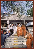 Descending the mandir steps