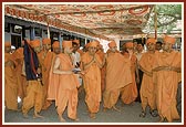 Engaged in darshan of the holy neem tree under which Shriji Maharaj discoursed